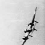 A still from camera gun footage taken by a Supermarine Spitfire Mark I of No. 609 Squadron RAF, flown by Pilot Officer M E Staples, showing a Messerschmitt Bf 110 banking steeply to port as it tries to avoid Staples' gun fire. This aircraft belongs, either to Erprobungsgruppe 210, which bombed the Parnall aircraft factory at Yate, north-east of Bristol, or to III/ZG 76 which was providing fighter cover.