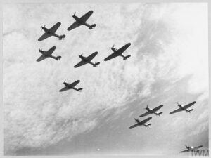 Nine Hawker Hurricanes of 85 Squadron, Royal Air Force seen from slightly below.