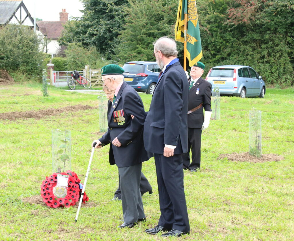 Jim Costigan presenting a wreath at the Memorial Orchard dedication service in 2016